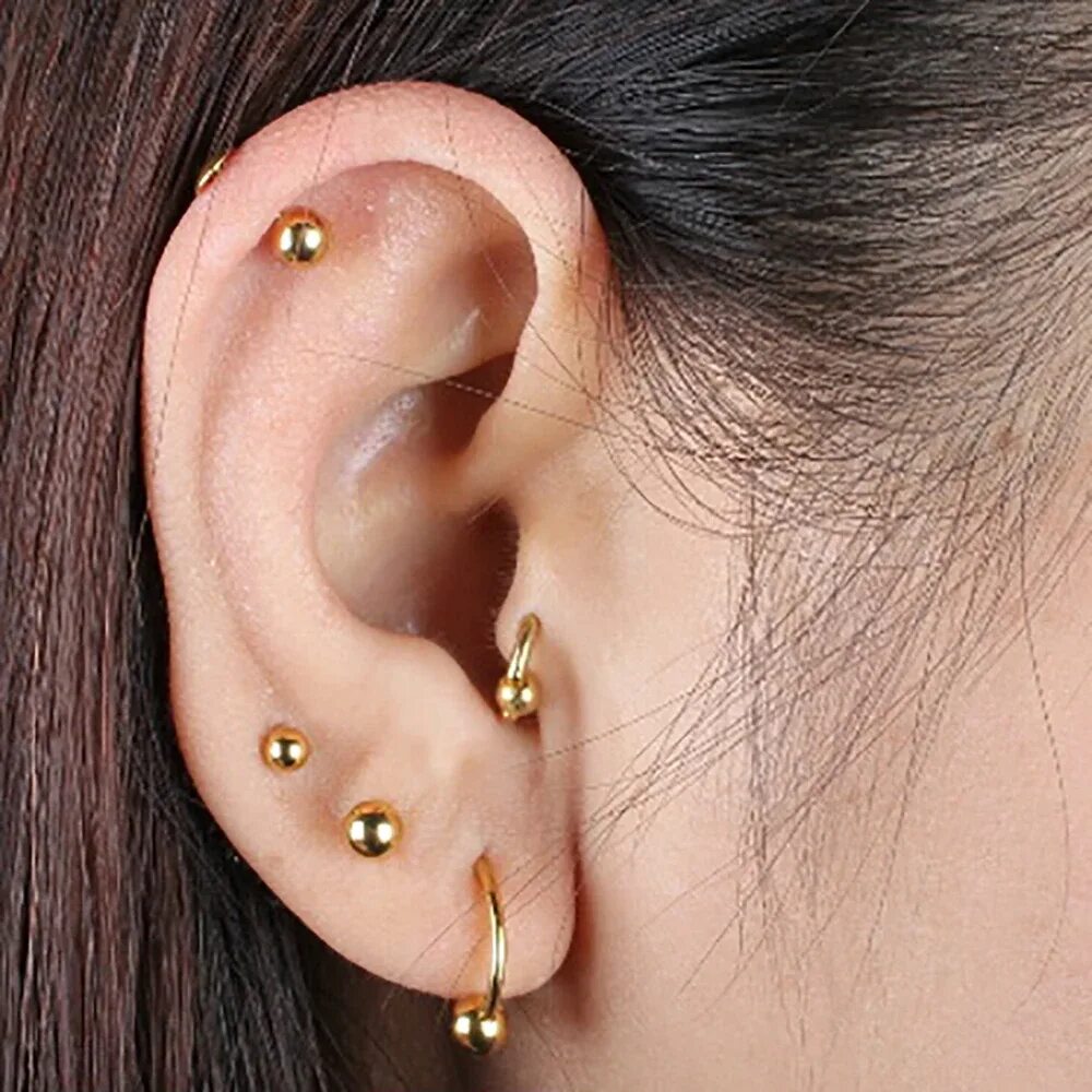 Прокол хеликс серьга крест. Прокол хеликс серьги 2 кольца. Украшения для пирсинга хряща уха. Пирсинг лабрет серьга. Серьги для пирсинга ушей.