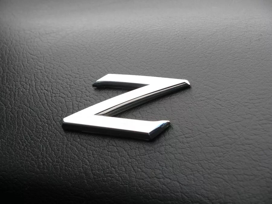 Nissan 370z лого. Z370 Nissan шильдик. Nissan z32 logo. Стилизованная буква z.
