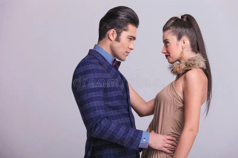 Looking at each other. A man and a woman look at each other. Couple looking at each other movie. Man and woman Wrapped around each other. Woman and man point at each other.