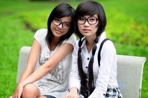 Two Asian girls with glasses.jpg. w:en:public domain. 