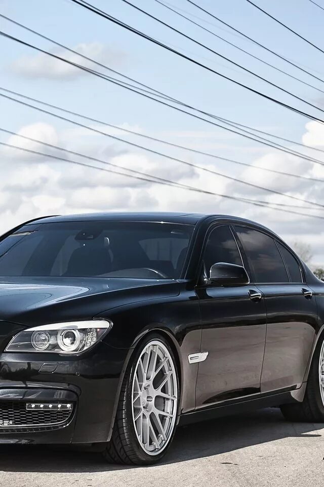 Bmw 7 тюнинг. BMW 750li. БМВ 750 li. БМВ 750li черная. Чёрный BMW 750 li.