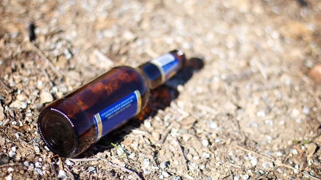 Bottom of bottle smile empty. Bog (beverage on ground). bottle beer service. without alcohol.