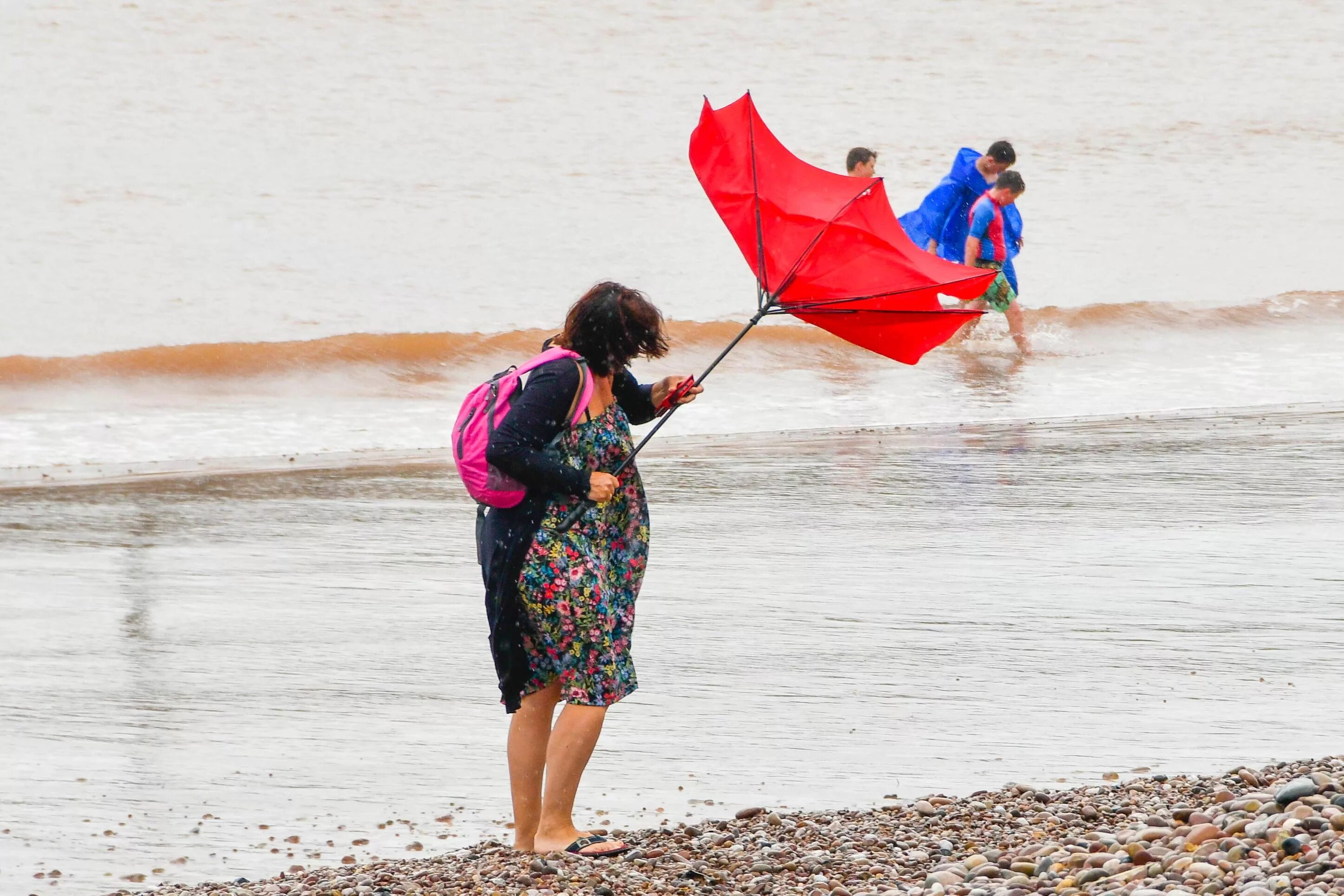 Bad weather on the Beach. Raining at the Beach. Rain on the Beach. Raining on the Beach.