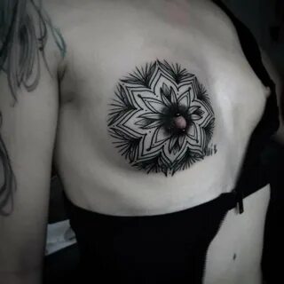 Slideshow sunflower tattoo inbetween boobs.