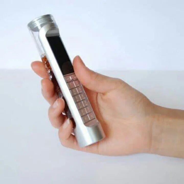Колот телефон. Цилиндрические Сотовые телефоны. Телефон который работает на Кока-Коле. Мобильный телефон Кока кола. Телефон Coca Cola мобильный.