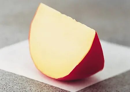 Голландский полутвердый сыр светло желтого цвета