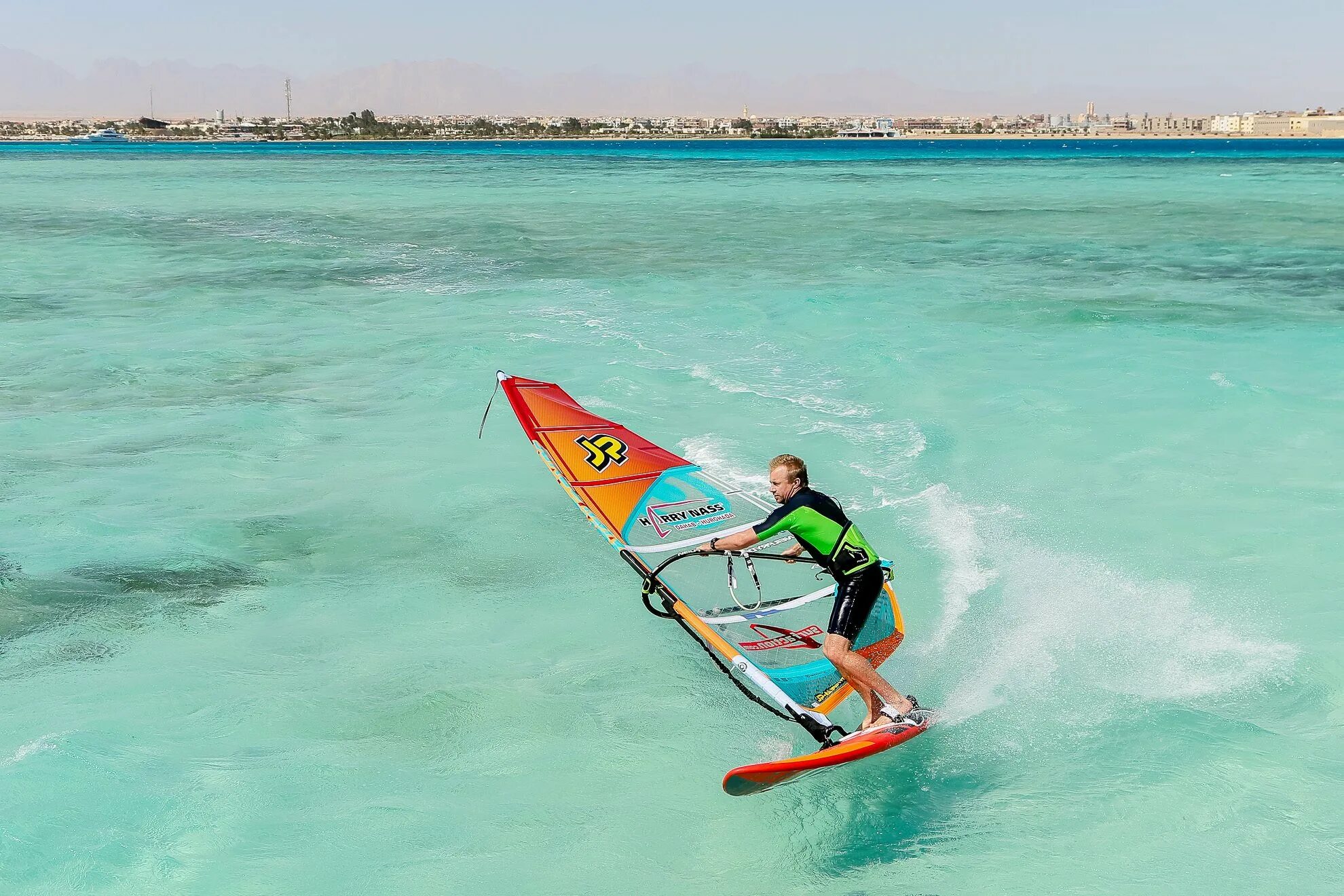 Complete the exchanges he is on windsurfing