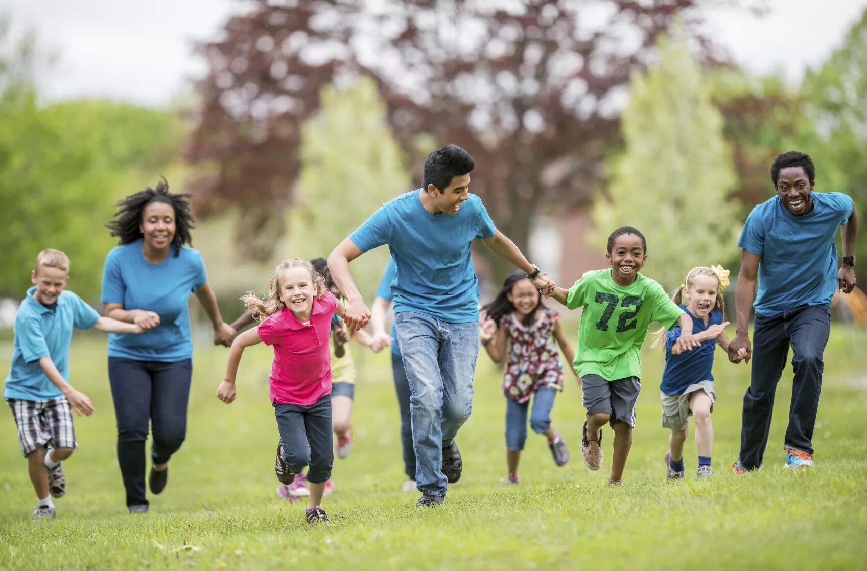 Camp counselor. Summer Camp. Summer Camp Band. Happy Kids and grown ups. Children in different ages.