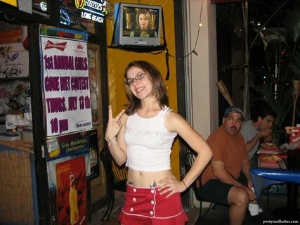 A photo of young girls at a wet t shirt contest in a nightclub. 