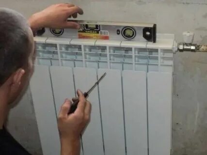 Вешать батарею