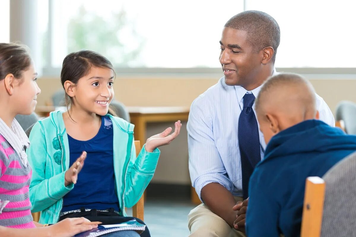 I teach children. Children talking. Teacher talking to principal. Talking to children. Kids talking in the class.
