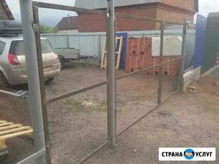 Привариваем петли на ворота к круглым столбам