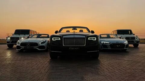 Line of luxury supercars in a garage