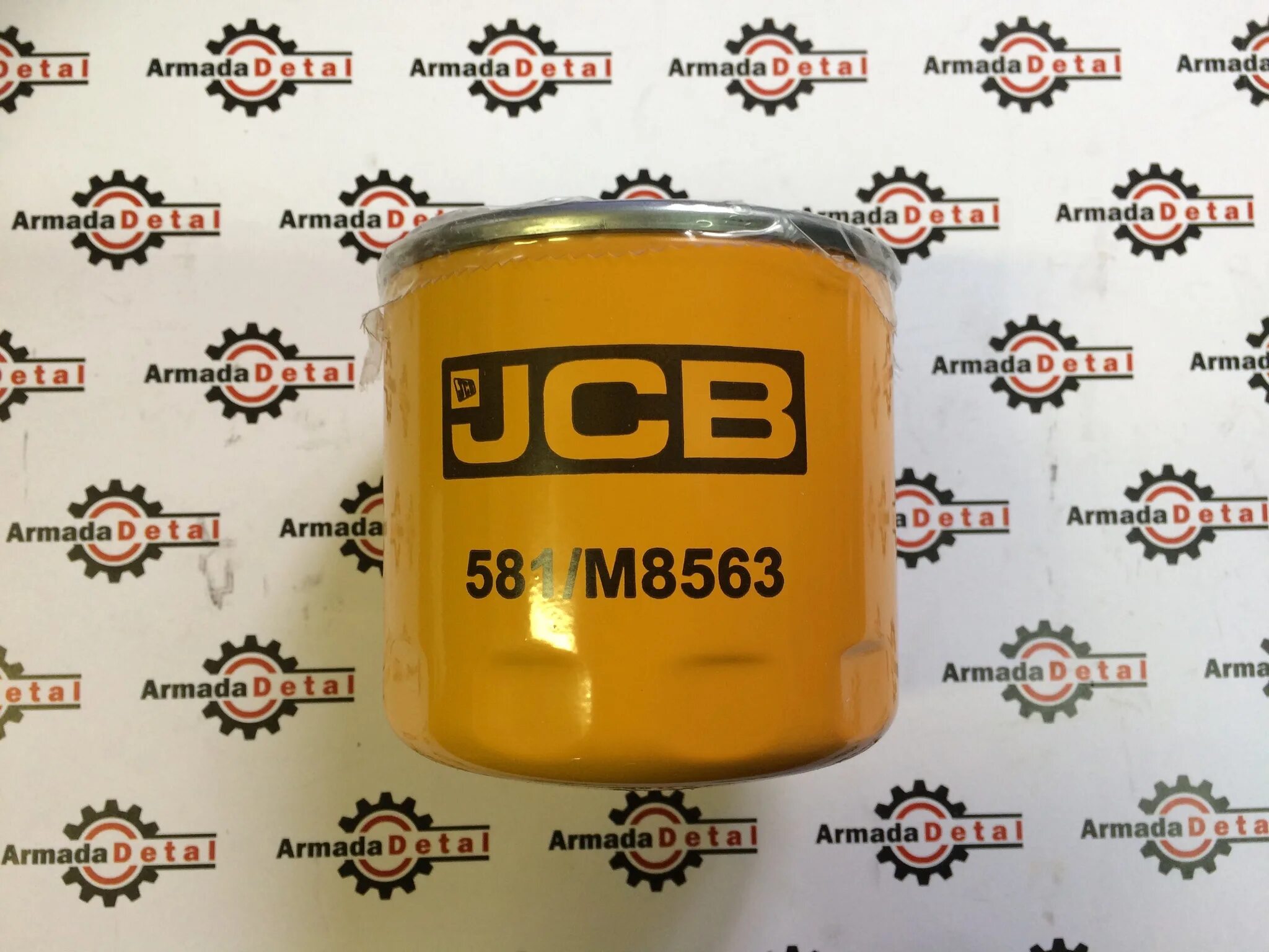 Фильтр КПП JCB 4cx. Фильтр JCB 581m7013. Фильтр коробки JCB 3cx 581/m8563. Фильтр осушитель JCB 3cx.