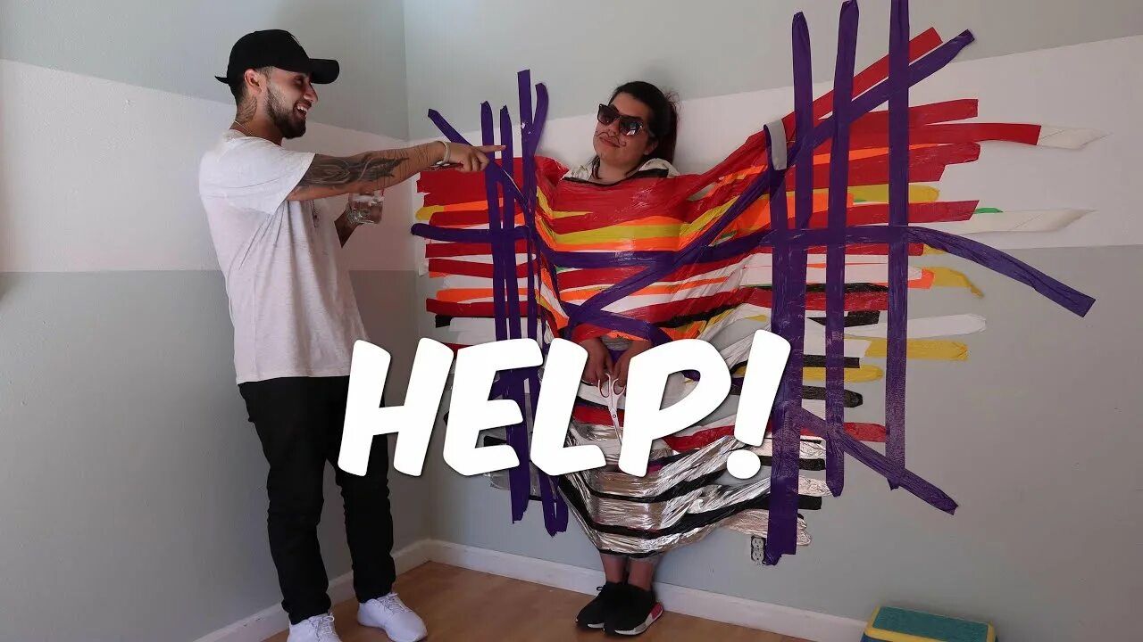 Taped challenge. Duct tape wall. scurbs taped to a wall.