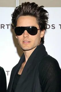 a man with dark sunglasses on his face 