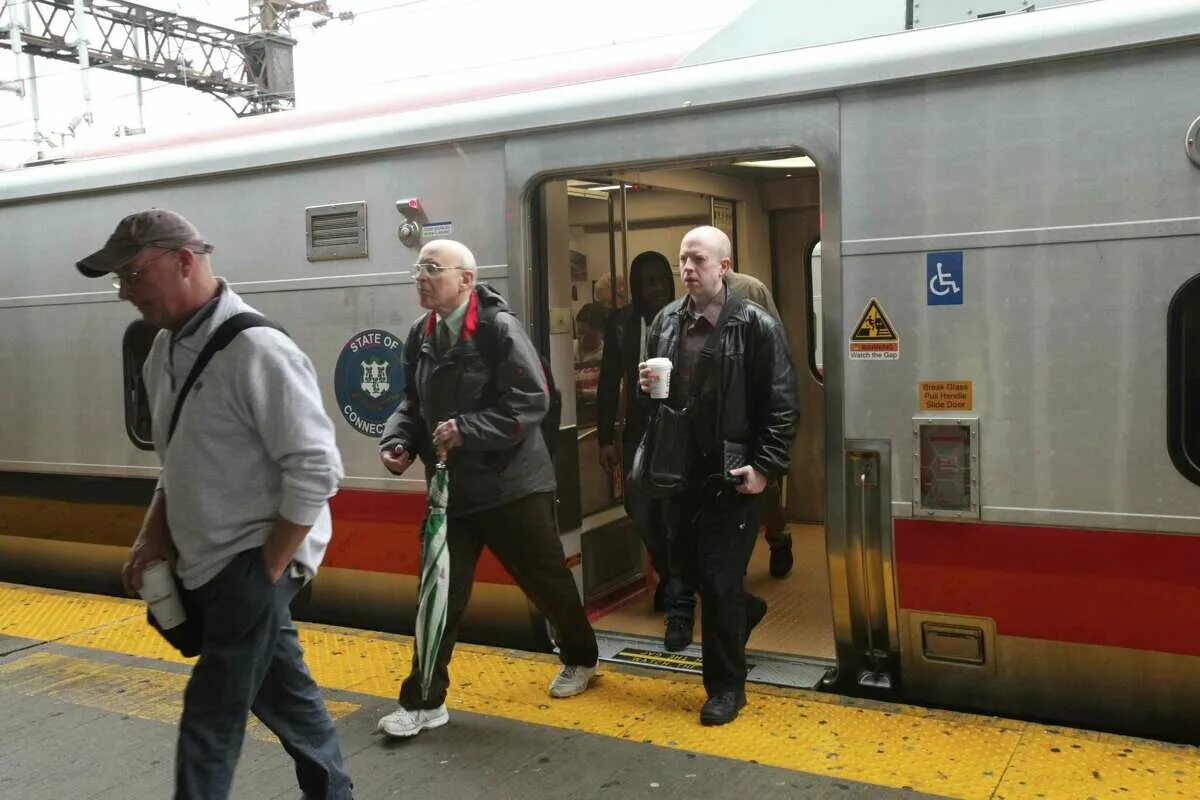 Getting off the Train. People getting on a Train. Get on the Train.