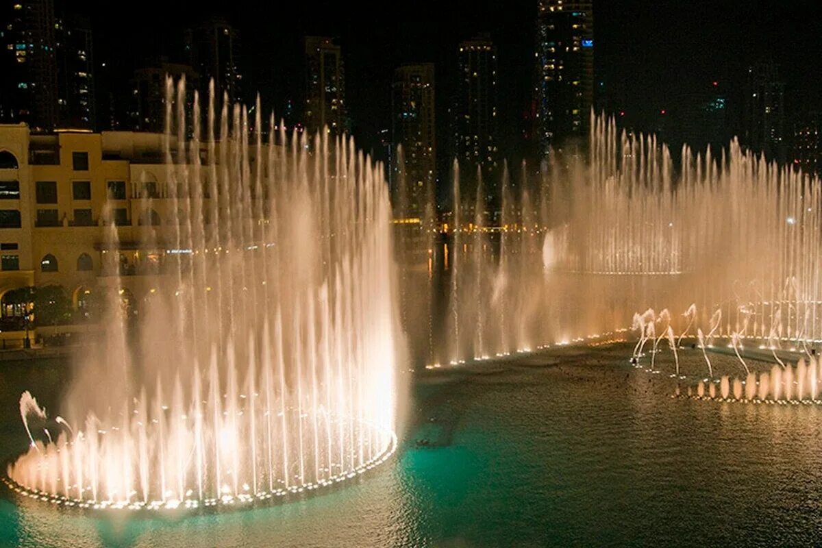 Самый большой фонтан. Поющие фонтаны бурдж халифа. Фонтан дубай. Фонтан метаморфозы сша. Дубай бурдж халифа поющие фонтаны.