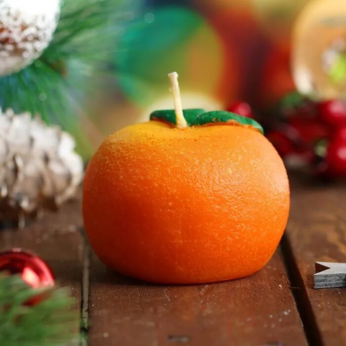 Мандарины свечи новый год. Новогодняя свеча "мандарин". Свеча мандарин. Новогодняя свечка. Свечка в мандарине.