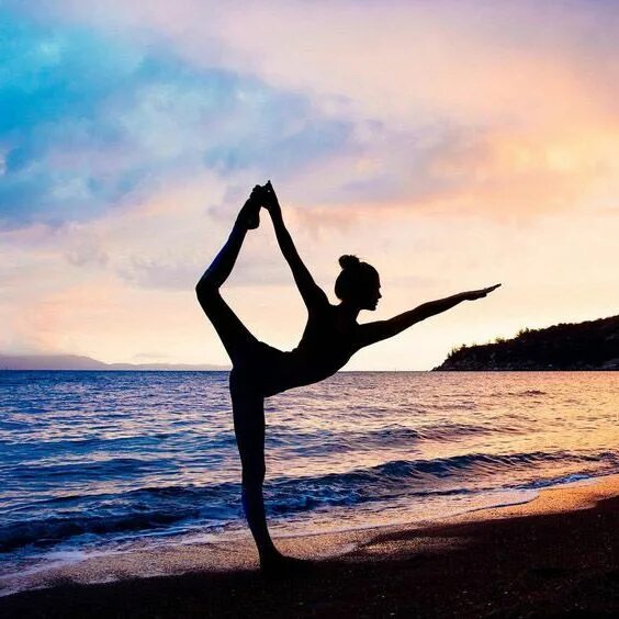 Woman doing gymnastics on beach - Stock Image - F005/8755 - Science Photo Librar