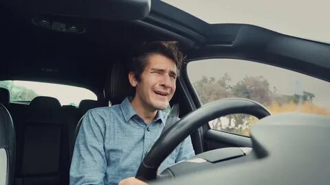 sad-desperate-man-crying-while-driving-car_vj1vn6pre F0000. 