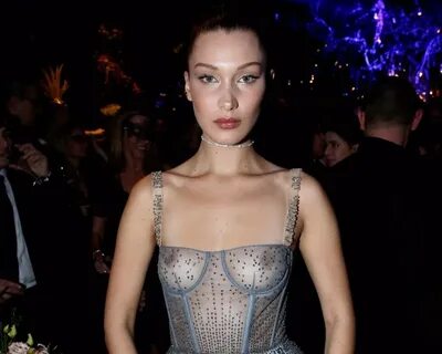 Bella Hadid Puts Her Tits On Display In A See Thru Dress.