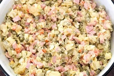 Оливье с колбасой и солеными огурцами салат