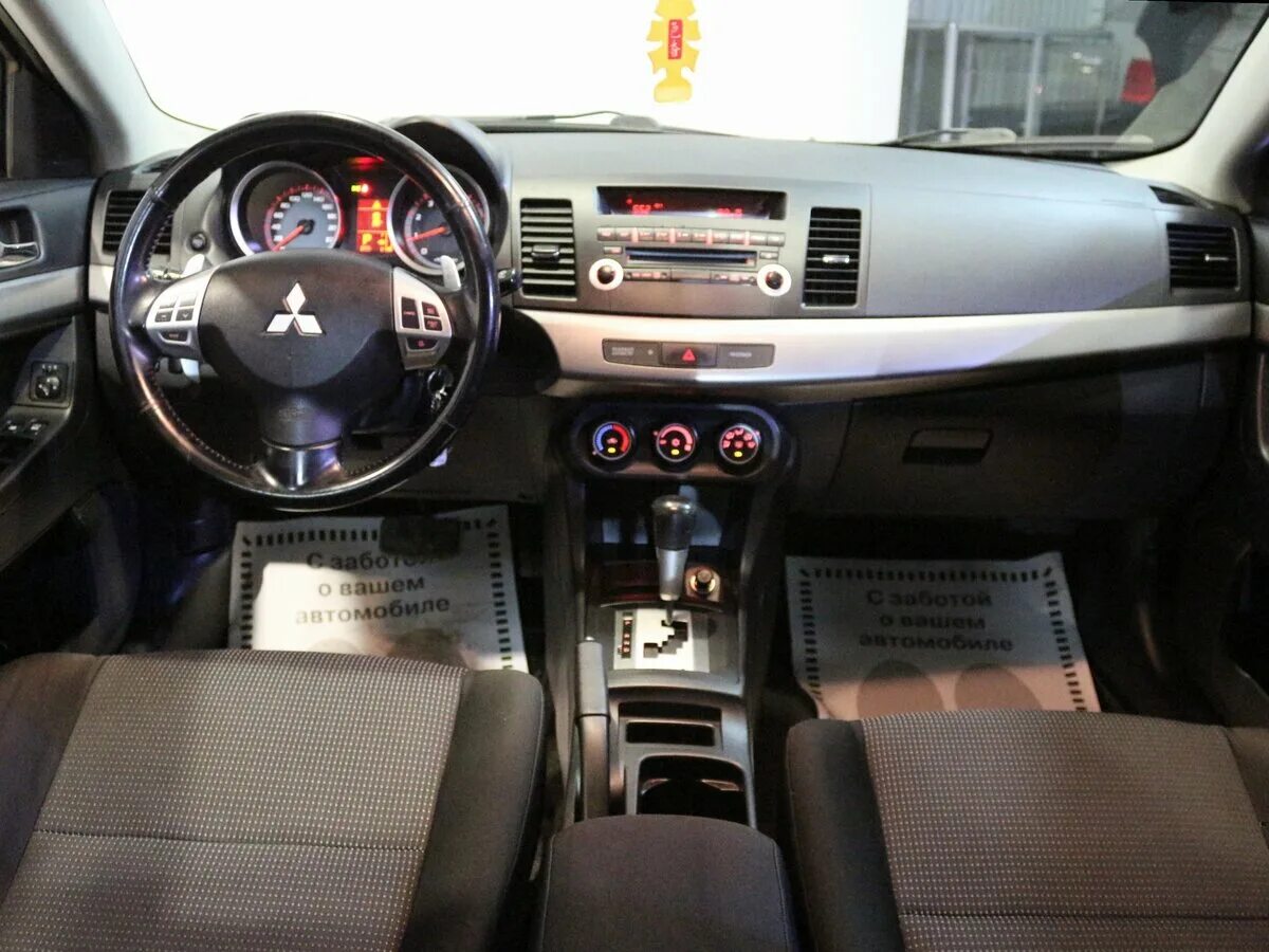 Купить лансер автомат. Lancer x 2008 салон. Mitsubishi Lancer 2008 салон. Митсубиси Лансер 10 1.5 автомат. Лансер 10 2.0 автомат.