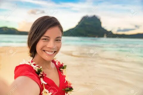 Luxury vacation selfie happy woman smiling taking photo with mobile phone o...