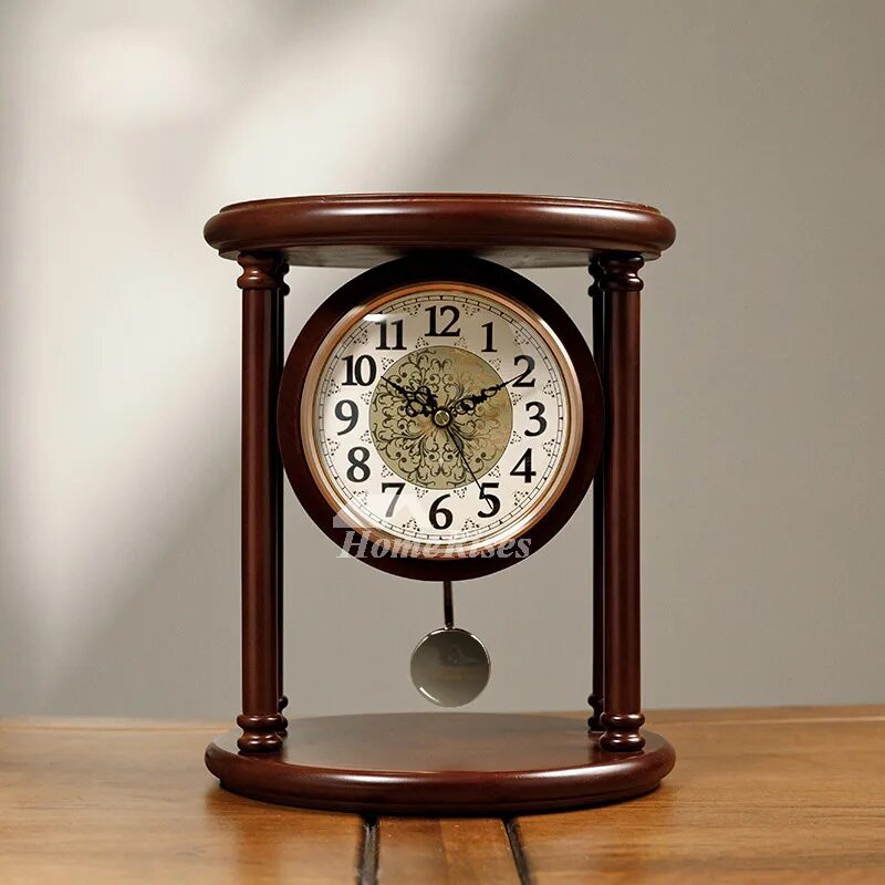 Desktop clock. Pendulum table clock. desk clock. deskclock. table clock figurine with pendulum rhythm.