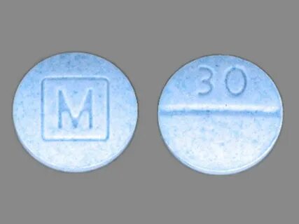 The pills found Thursday are colored and marked with an imprint mimicking O...