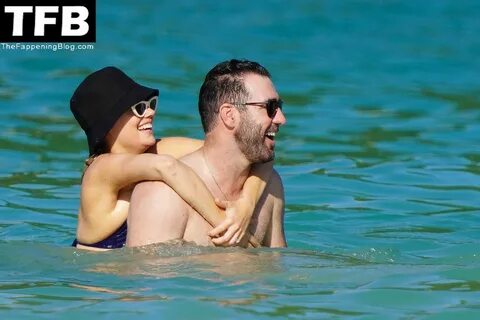 Kate Upton Looks Chic in a Blue Swimsuit as She Soaks Up the Sun with Justi...