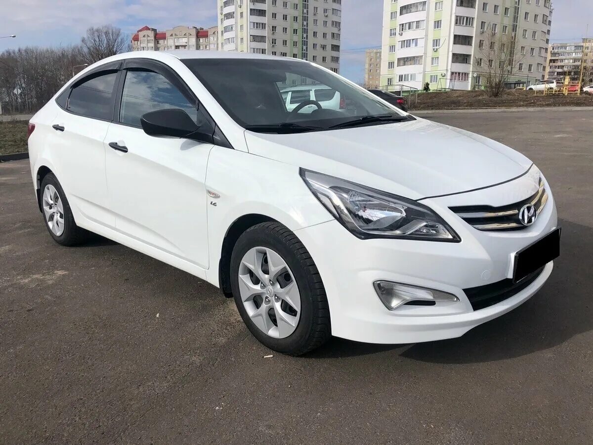 Хендай солярис 2012 1.4. Hyundai Solaris 2015 седан. Хендай Солярис 15 года. Solaris 2015 Hankook. Белый седан Hyundai Solaris i Рестайлинг 1.6 at (123 л.с.) Elegance.