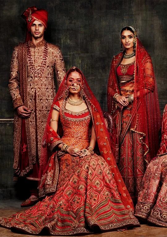 This photo shows a man wearing an Indian sherwani. A sherwani is a long jacket. 