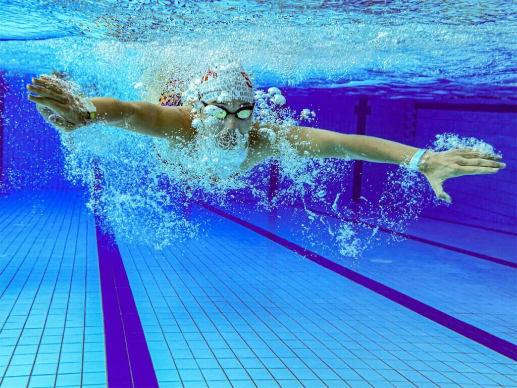 He swims in the pool