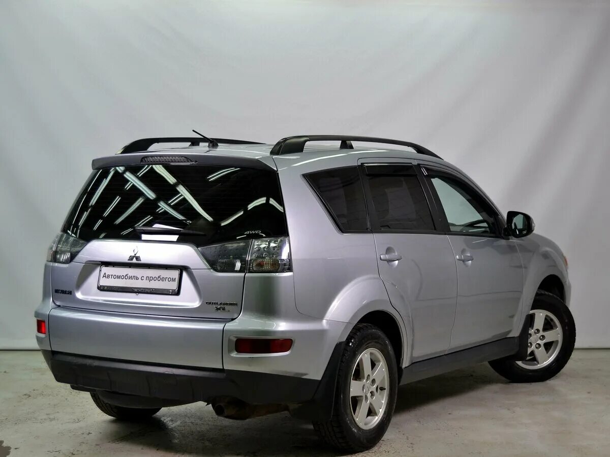 Мицубиси аутлендер хл 2011. Митсубиси аутлендер хл 2010. Mitsubishi outlander xl рестайлинг. Mitsubishi outlander xl 2010. Mitsubishi outlander ii рестайлинг.