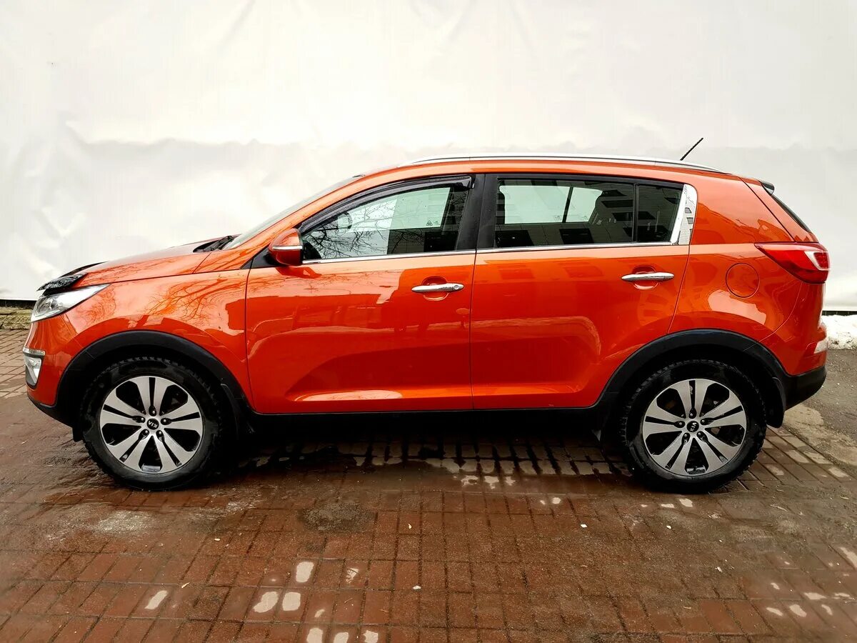 Киа спортейдж 2012 купить. Оранжевый Kia Sportage 3. Оранжевый кия Спортаж 3. Киа Спортейдж 2012 оранжевый. Спортейдж 3 2012.