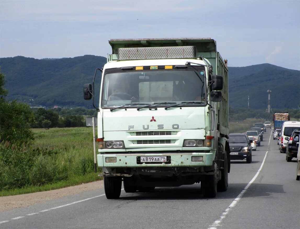 Mitsubishi fuso great. Mitsubishi Fuso the great. Мицубиси Фусо 1990. Грузовики Mitsubishi Fuso старые. Mitsubishi Fuso 1986.