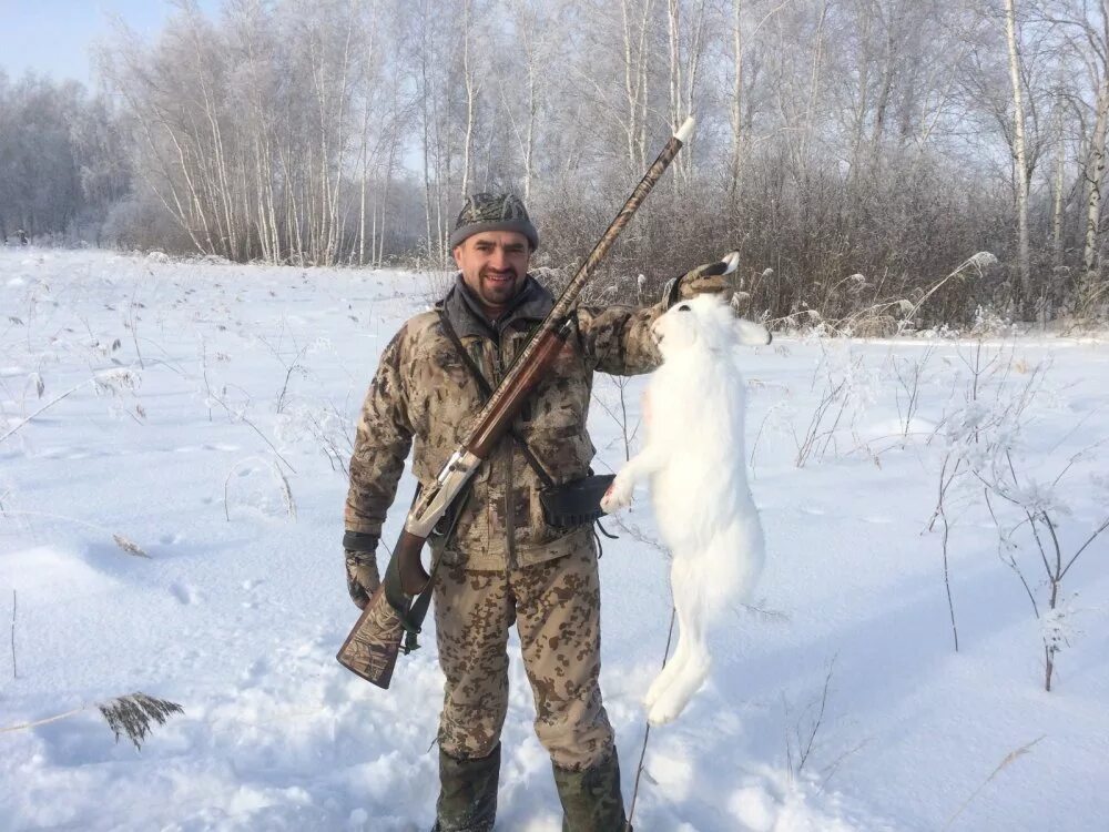 Сибирский охотник охота на зайца. Охотник зимой. Охота на зайца в Сибири зимой.