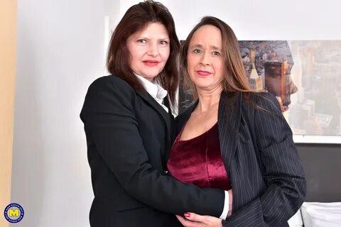 Mature British women shed business attire before having lesbian sex! 
