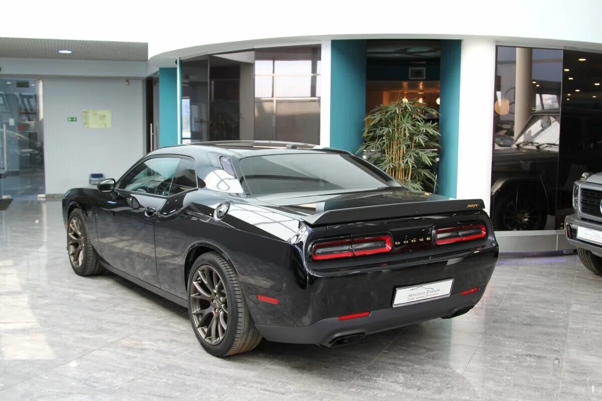 Додж челленджер бу. Dodge Challenger 2015 3.6. Додж Челленджер 3 поколения. Dodge Challenger 2015 черный. Dodge Challenger 2022.