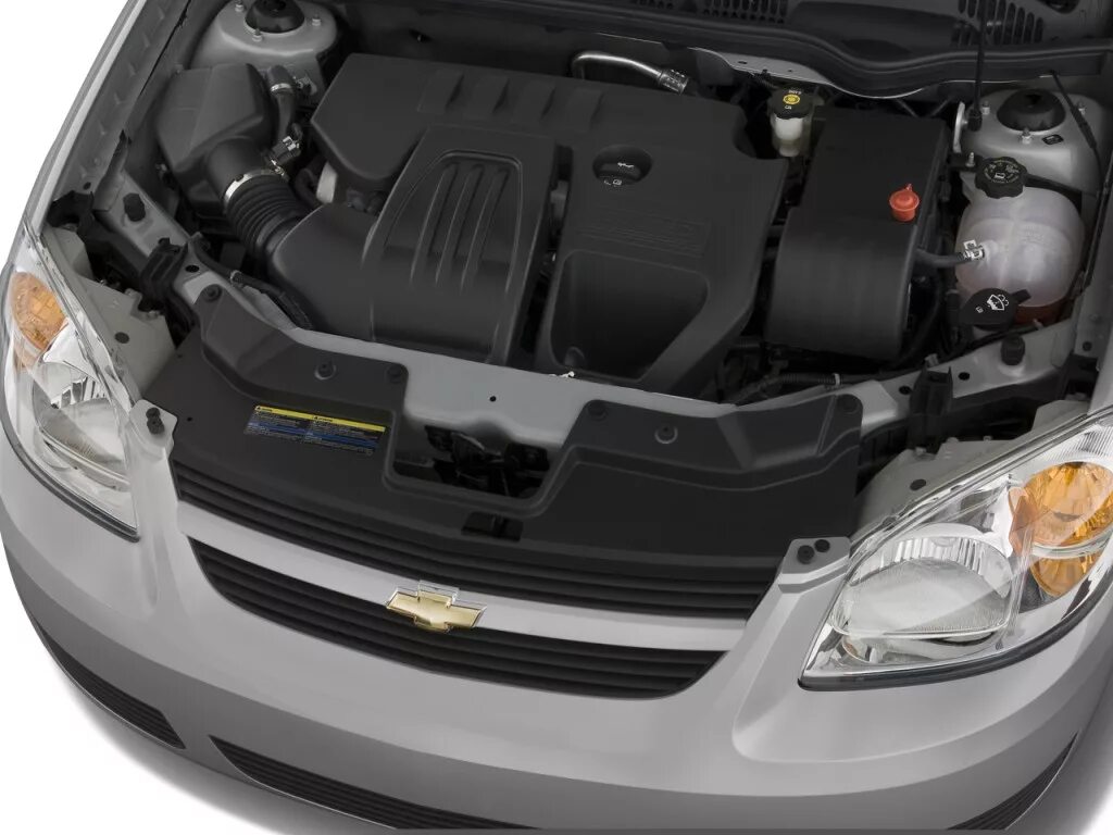 Капот шевроле кобальт. Chevrolet Cobalt 2013 мотор. Chevrolet Cobalt капот мотор. Шевроле кобальт моторное отделение. Моторный отсек Шевроле кобальт.