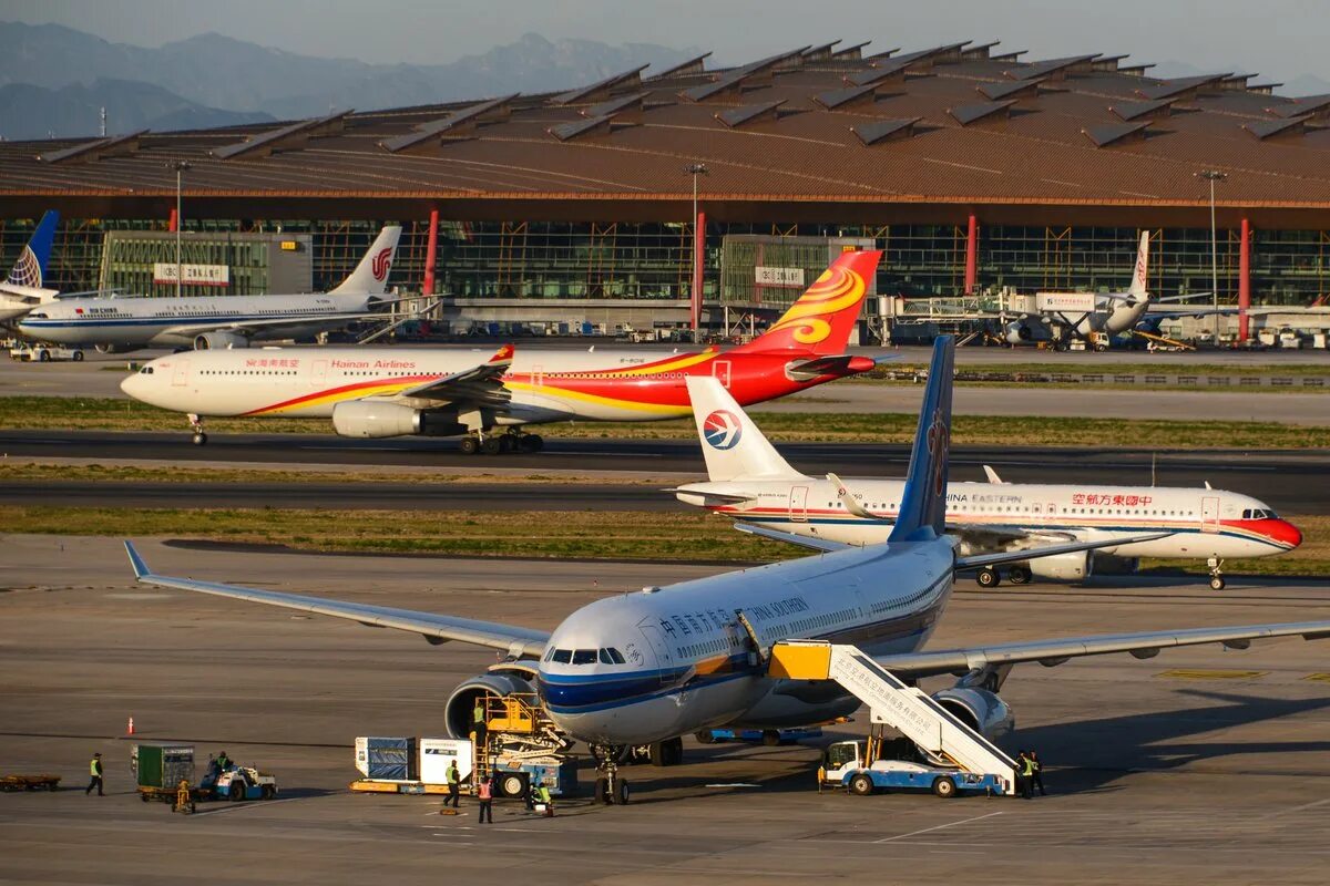 Beijing capital airlines. Beijing capital airlines бизнес класс. Beijing capital airlines регистрация. Хайнань авиакомпания. Beijing capital airlines регистрация.