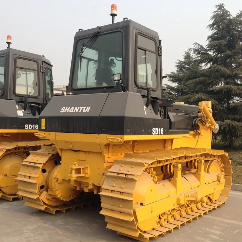 Shantui sd16l. Бульдозер shantui sd32. Шантуй сд 22. Шантуй 16 бульдозер. Гусеничный бульдозер shantui sd32.