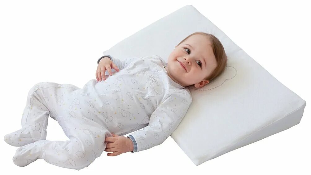 Какой купить подушка ребенок. Подушка детская. Подушка для новорожденного. Ортопедическая подушка для новорожденных. Наклонная подушка для новорожденного.