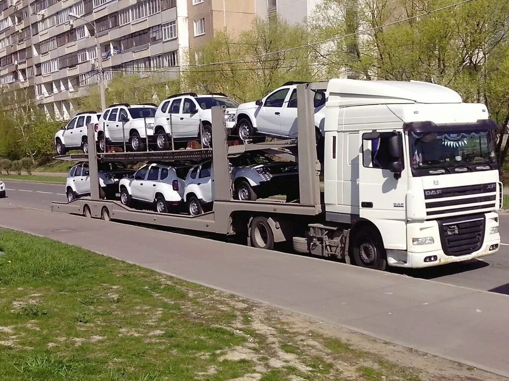 Грузовиков стоимость перевозки. Трак Вольво автовоз. Автовоз КАМАЗ 941300. Автовоз ТК эксис КАМАЗ. Автовоз Скания.