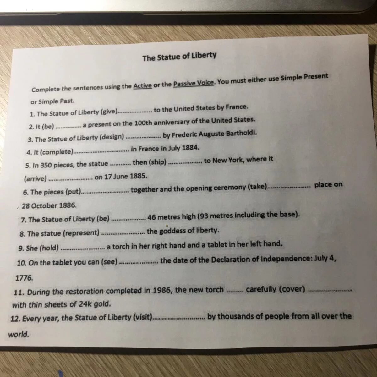 Complete the sentences use the Passive Voice. Complete the sentences Active or Passive Voice use simple present or simple past the Statue of Liberty give. Complete the sentences using the Passive. Complete the sentences using the Passive Voice after. Rewrite the sentences in the active