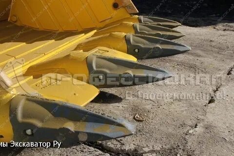 Межзубьевая защита ковша экскаватора