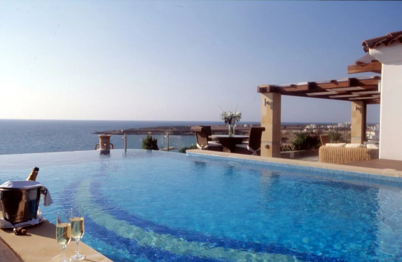 Отель coral beach. Coral Beach Hotel Кипр Пафос. Корал Бич Резорт Кипр. Coral Beach Hotel & Resort 5* (Пафос). Беач Ресорт Кипр отель.