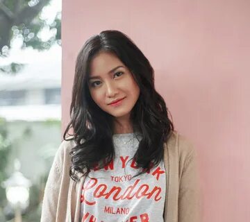 Long wavy hair: Asian woman with long black wavy hair wearing a shirt and c...